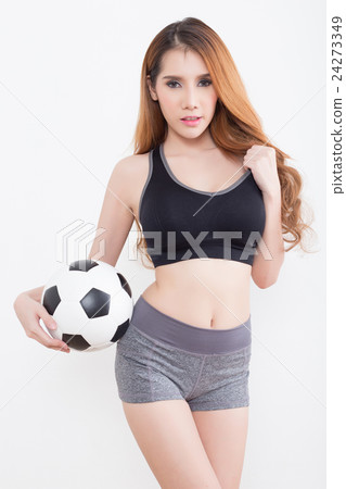 Young sexy woman with soccer ball 24273349