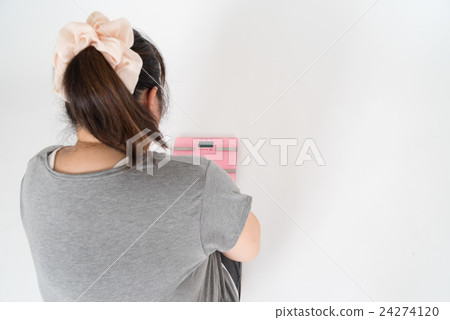Fat woman watching the scale Fat woman watching the scale 24274120