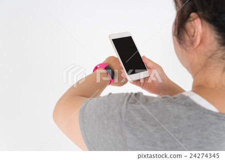 Fat woman watching smart watch and smartphone 24274345