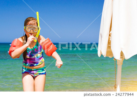 Child relaxing on Cretan sea in swimming glasses Child relaxing on Cretan sea in swimming glasses 24277944
