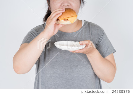A fat woman with a hamburger 24280576