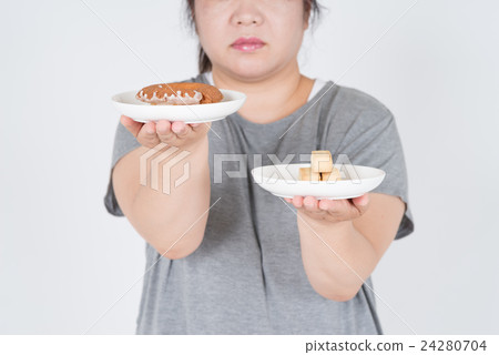 A fat woman with a donut and a diet meal A fat woman with a donut and a diet meal 24280704