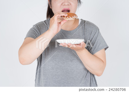 Fat woman eating a donut 24280706