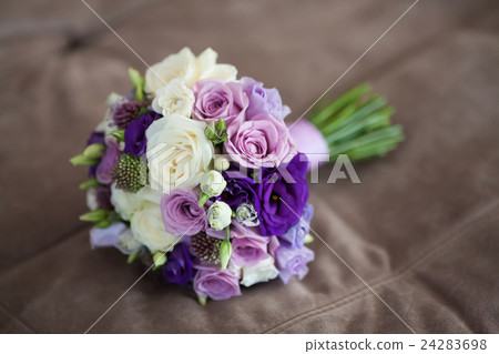 Close up of beautiful wedding bouquet on beige Close up of beautiful wedding bouquet on beige 24283698