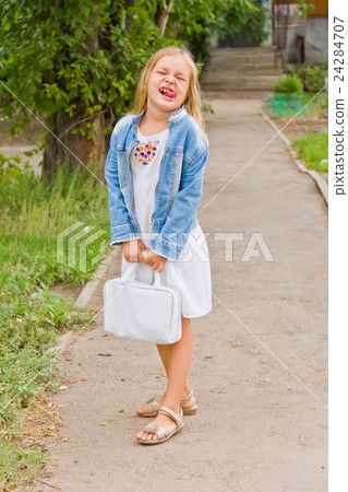 Girl makes faces imitate witch 24284707