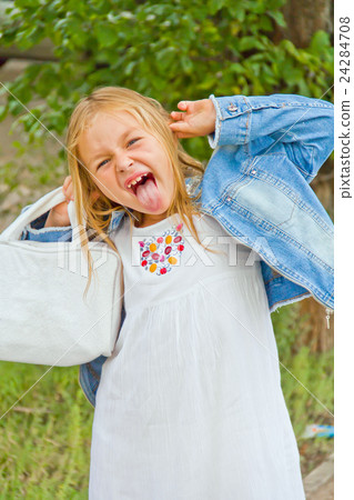 Girl makes faces imitate witch 24284708