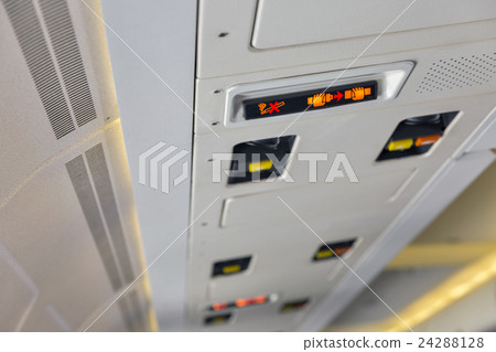 Service panel in passenger airplane closeup 24288128