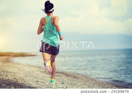 young woman trail runner running on seaside young woman trail runner running on seaside 24289670