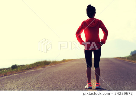 young asian woman runner on mountain trail young asian woman runner on mountain trail 24289672