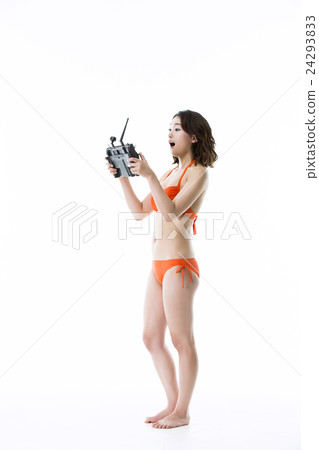 Beautiful Asian Girl in Bikini Operating Drone 24293833