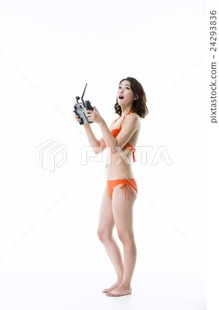 Beautiful Asian Girl in Bikini Operating Drone 24293836