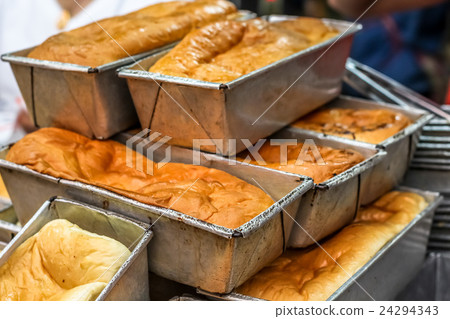 Close up various fresh baked buns/bread in market 24294343