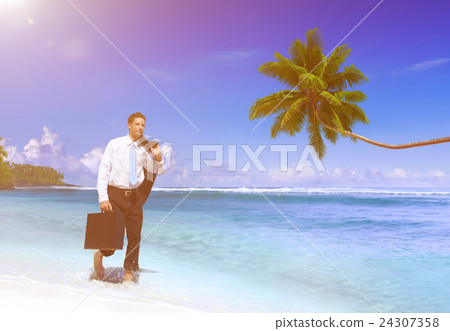 Businessman Walking Along the Tropical Beach 24307358