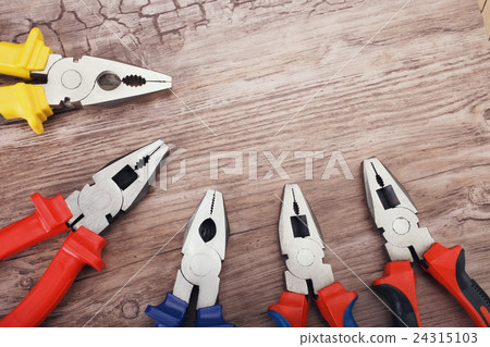 copyspace image set of pliers on wooden board  24315103