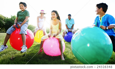 Family Outdoors Playing Ball Concept Family Outdoors Playing Ball Concept 24316348