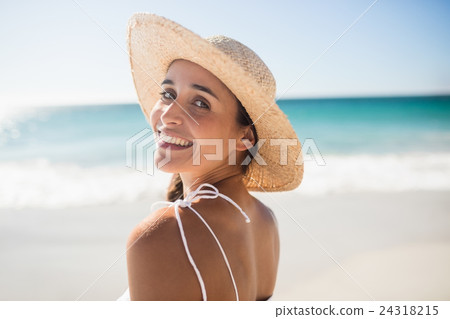 Happy woman posing on the beach Happy woman posing on the beach 24318215