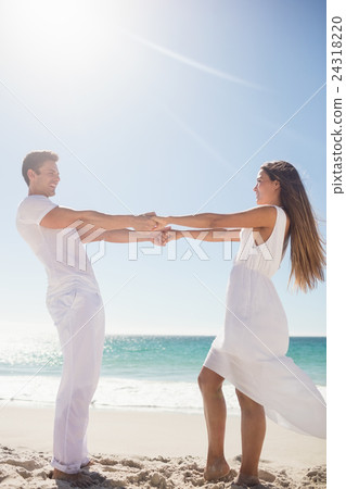 Cute couple holding hands Cute couple holding hands 24318220