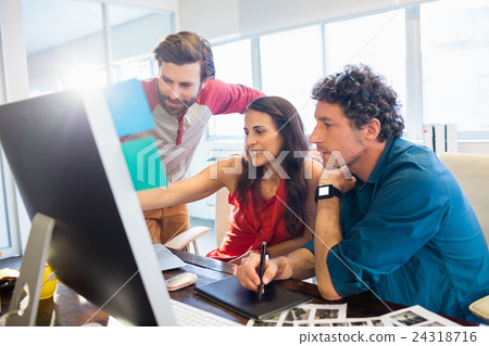 Colleagues using a graphic pad Colleagues using a graphic pad 24318716