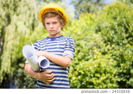 Portrait of serious boy pretending to be a worker Portrait of serious boy pretending to be a worker 24318838