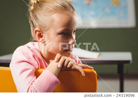 Girl leaning against chair 24319096