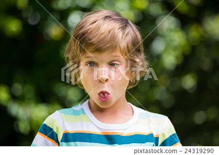 A little boy is making a funny face 24319290