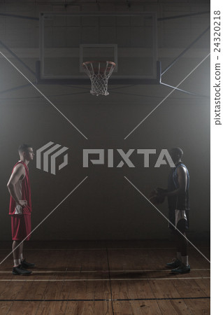 Two basketball rival looking each other face to face Two basketball rival looking each other face to face 24320218