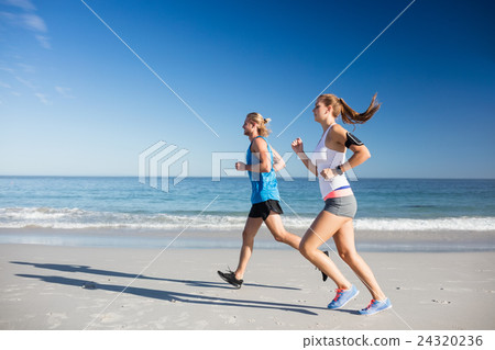 Friends jogging at the beach Friends jogging at the beach 24320236