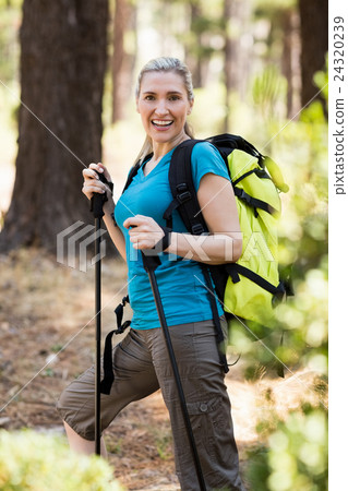 Portrait of a woman smiling and hiking 24320239