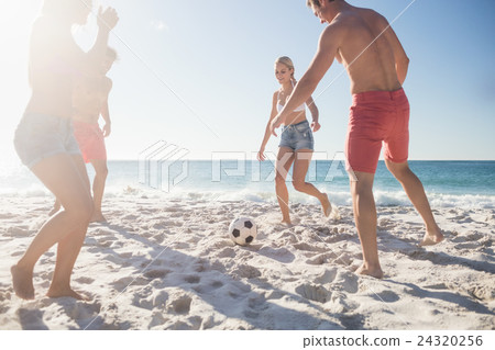 Friends playing football Friends playing football 24320256