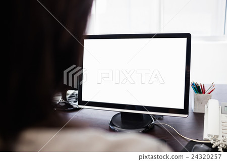 Casual businesswoman working on laptop Casual businesswoman working on laptop 24320257