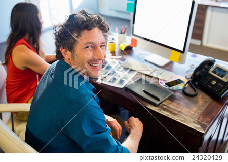 Colleagues using technology Colleagues using technology 24320429