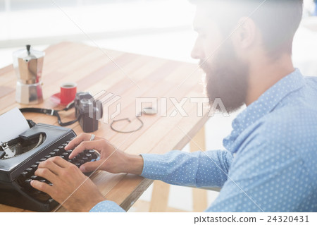 Hipster using type writer 24320431