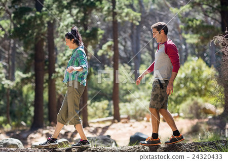 Couple smiling and walking with balance Couple smiling and walking with balance 24320433