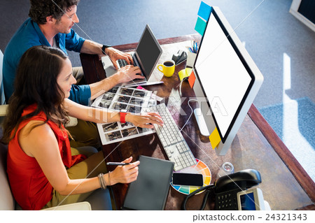 Colleagues using a graphic pad Colleagues using a graphic pad 24321343