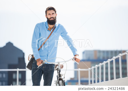 Hipster walking his bike 24321486
