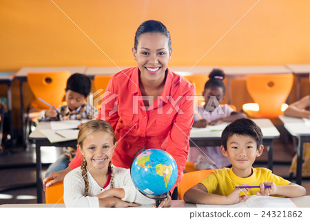 Happy teacher posing with two pupils 24321862