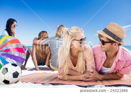 Friends lying on the beach 24321866