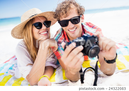 Portrait of couple posing at the beach Portrait of couple posing at the beach 24322083