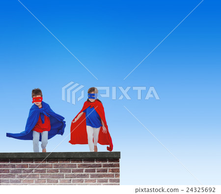 Composite image of masked kids running pretending to be superheroes Composite image of masked kids running pretending to be superheroes 24325692