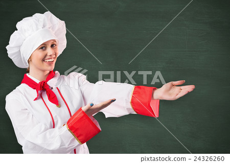 Composite image of pretty chef presenting with hands Composite image of pretty chef presenting with hands 24326260