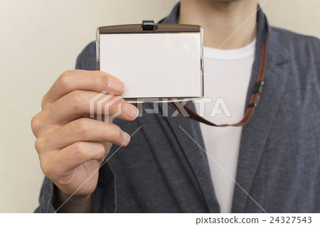 Casual businessman showing employee ID card 24327543