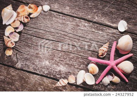 Sea shells on wooden background Sea shells on wooden background 24327952