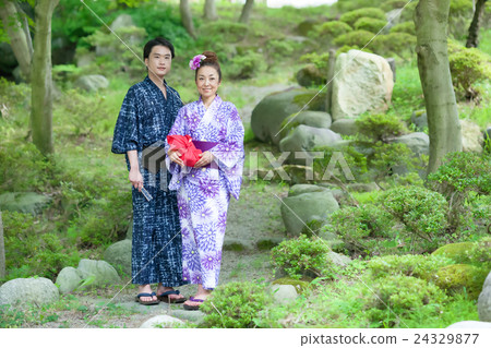 A couple wearing a Yukata going to Midorioka A couple wearing a Yukata going to Midorioka 24329877