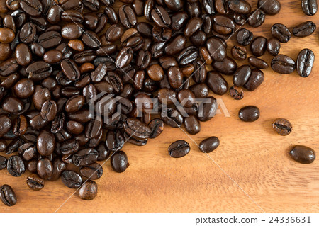 Coffee beans on wood background 24336631