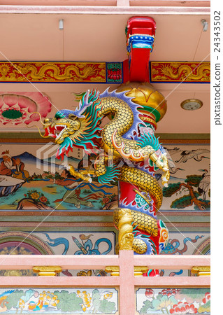 Chinese dragon wrapped around red pole at bacony Chinese dragon wrapped around red pole at bacony 24343502