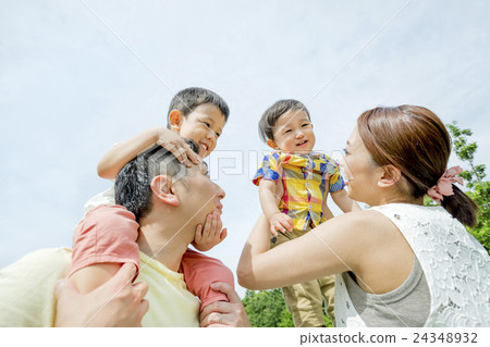 Four people playing in the park 24348932