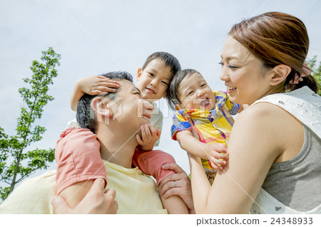 Four people playing in the park 24348933