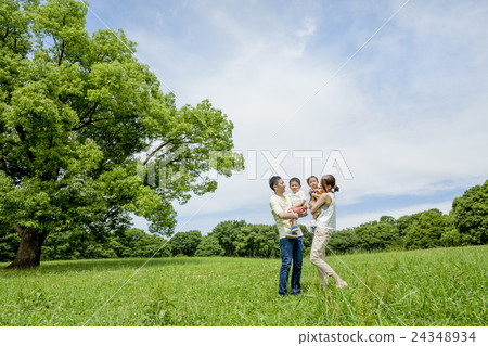 Four people playing in the park 24348934