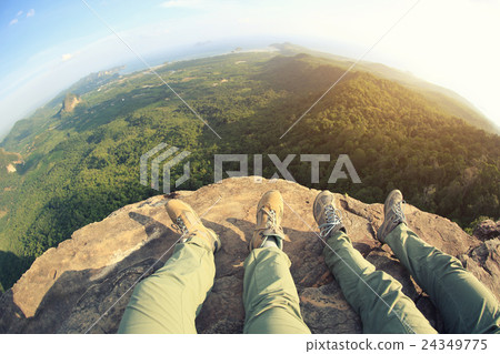 hiking legs enjoy the view on mountain peak 24349775