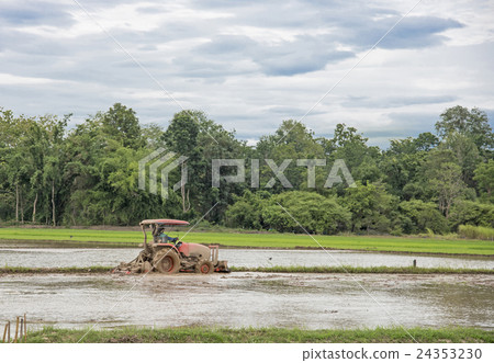 Thai farmer in heavy tractor during cultivation 24353230